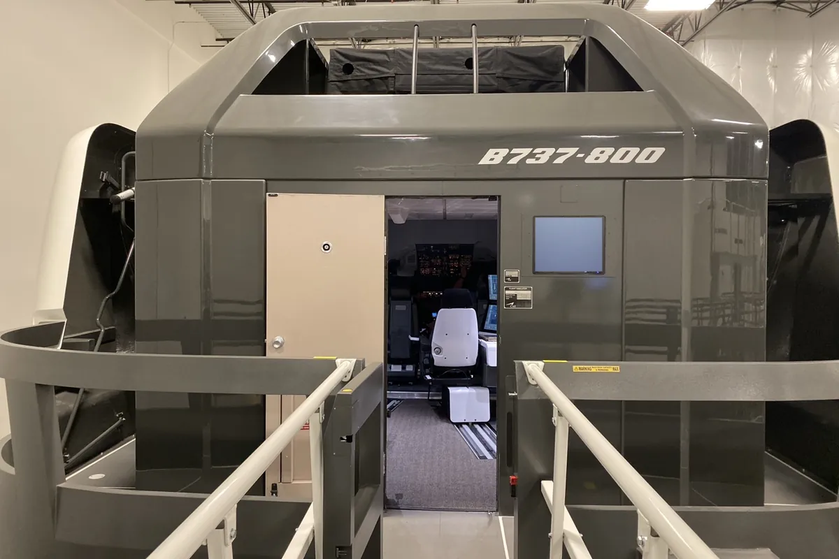 Boeing B737-800 full flight simulator cab with its access bridge at DFW, Dallas, Building 1
