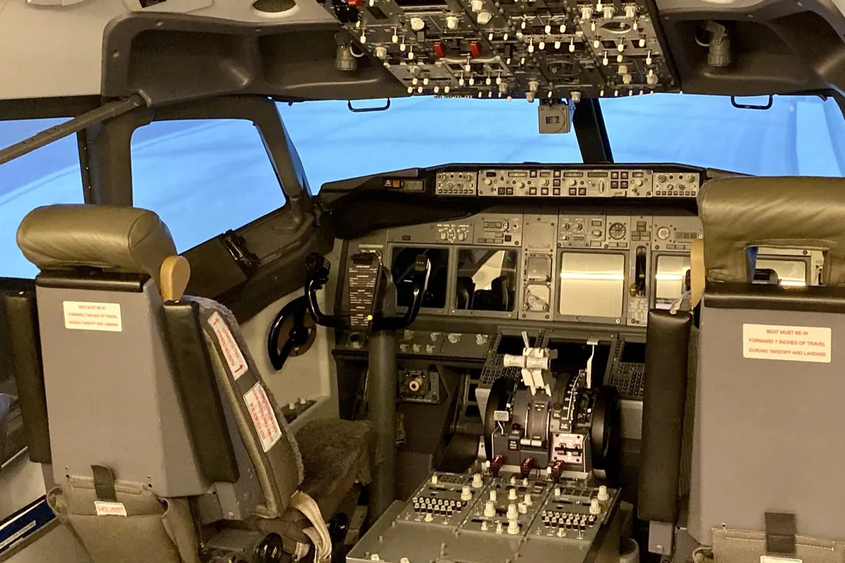Boeing 737 simulator flight deck with the visual display in the windows