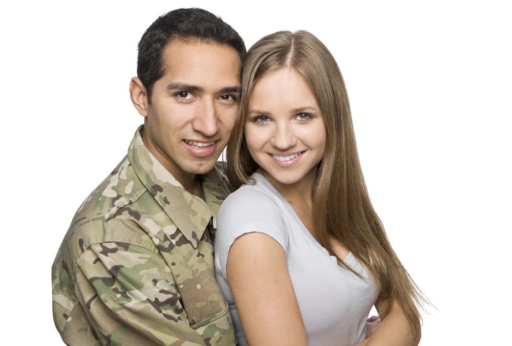 Smiling military service member and spouse